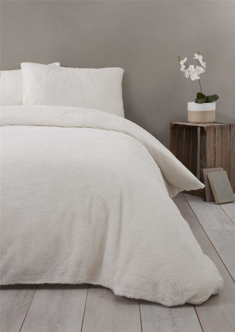 Elegant ivory cream Teddy Fleece Duvet Set featuring a cosy, energy-efficient design and popper closure
