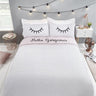 Brightly coloured duvet cover with eyelash and polka dot print, fully reversible design
