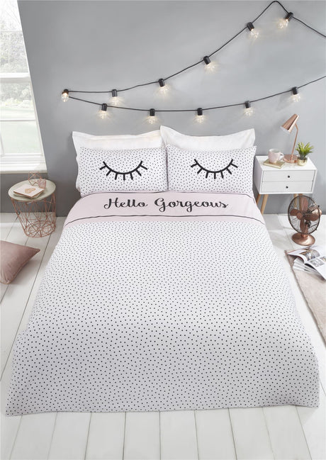 Brightly coloured duvet cover with eyelash and polka dot print, fully reversible design
