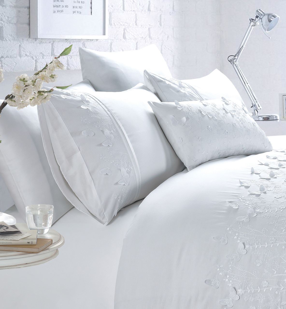 A stunning Papillon Boudoir Cushion adorned with 3D butterfly embroidery in blush pink for a delicate touch