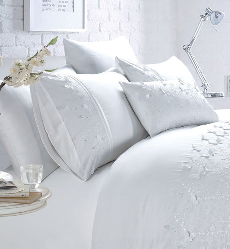A stunning Papillon Boudoir Cushion adorned with 3D butterfly embroidery in blush pink for a delicate touch