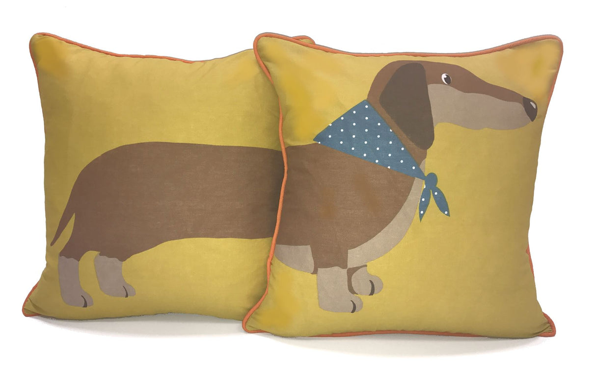 Reversible cushion with cute sausage dog design and piped edge detail
