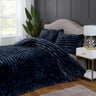 The duvet set displayed with decorative pillows, illustrating its opulent and refined aesthetic