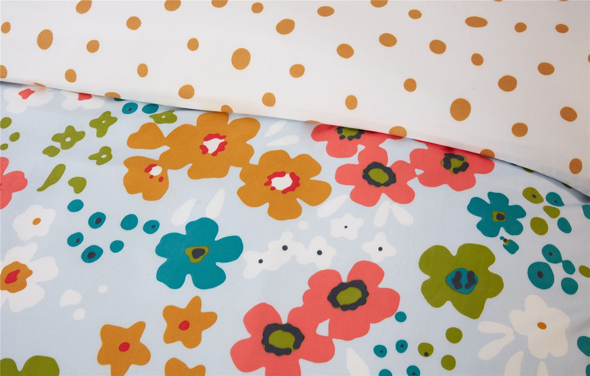Close-up of Betty Duvet Set showcasing playful floral motifs combined with classic polka dot details in a lively and artistic arrangement