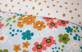 Close-up of Betty Duvet Set showcasing playful floral motifs combined with classic polka dot details in a lively and artistic arrangement