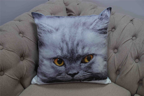 A luxurious velvet cushion featuring a cute photographic persian cat with amber eyes