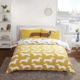 Single duvet set with colourful sausage dog print and coordinating pillowcase featuring a stretched sausage dog across the pillow