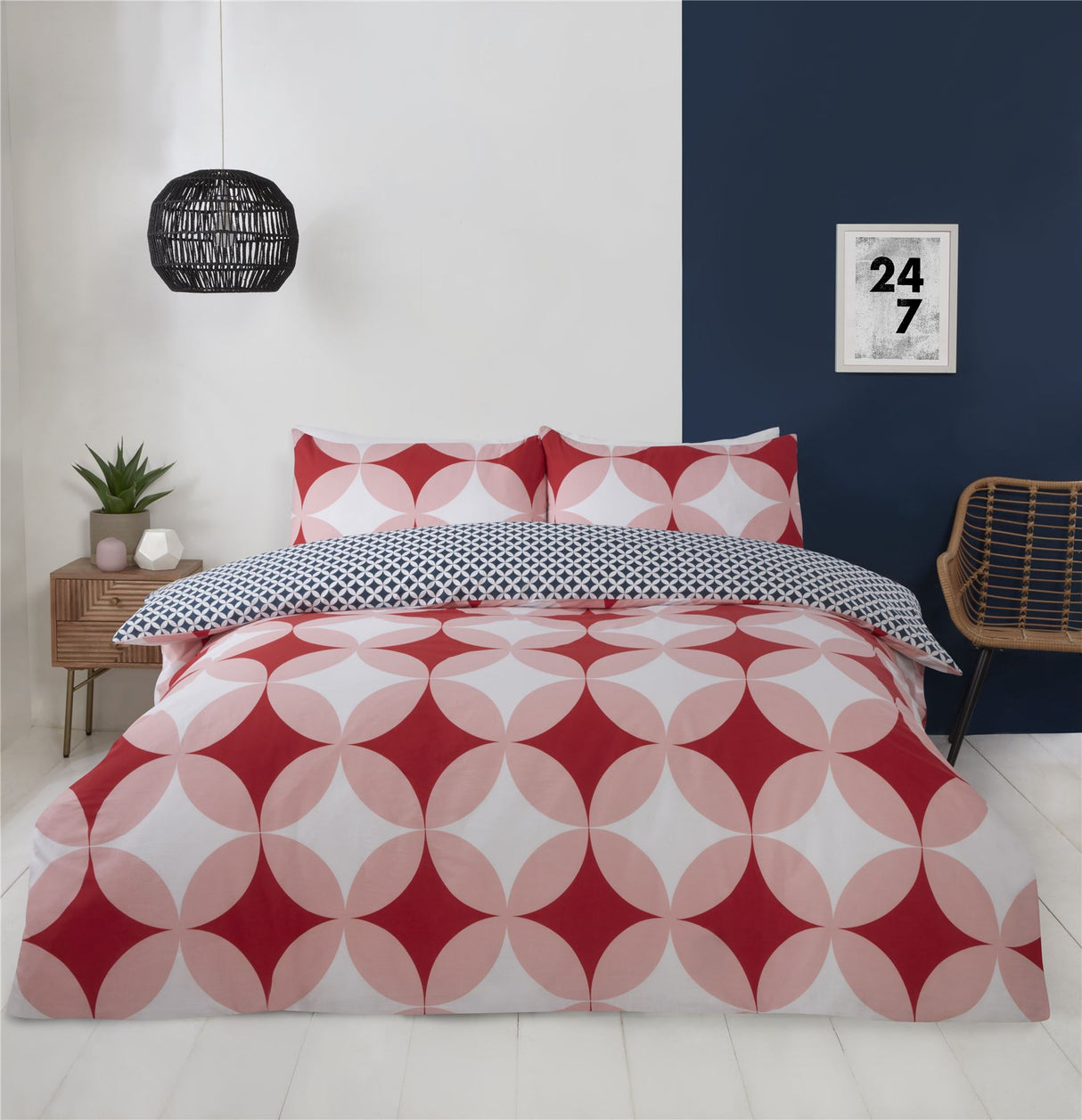 Reversible bedding featuring large and small geometric prints in bold colours