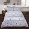 Close-up of the Reindeer Road design on brushed cotton duvet set showcasing a festive townscape with reindeer and Christmas trees in red and grey