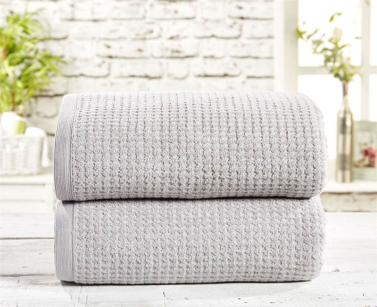 A soft and absorbent waffle towel in a neutral color