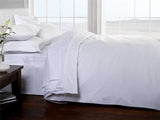 Full view of the luxurious 100% cotton flat sheet, highlighting its quality and fine craftsmanship