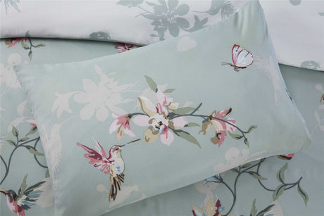 Reversible duvet cover with easycare fabric, popper closure, and intricate hummingbird and floral motifs for stylish bedroom decor