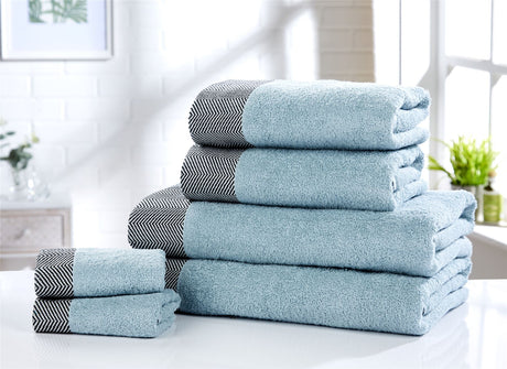 Large bath sheet measuring 90x140cm made from soft, highly absorbent cotton, featuring stylish herringbone detailing