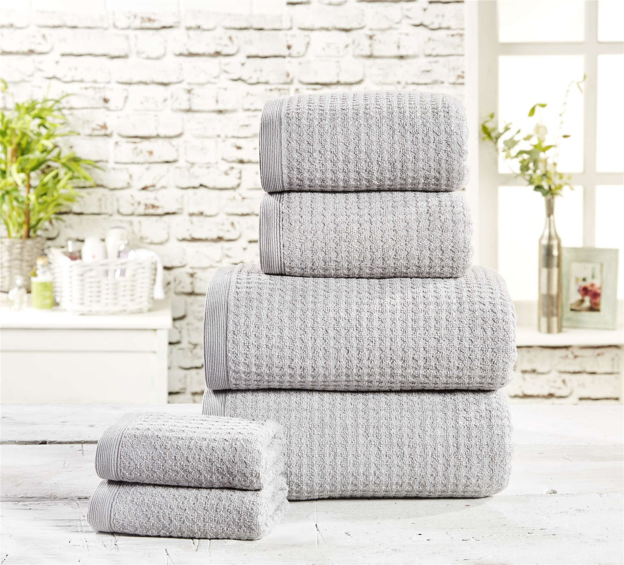 Soft and absorbent waffle towel in white, perfect for a luxurious bath experience