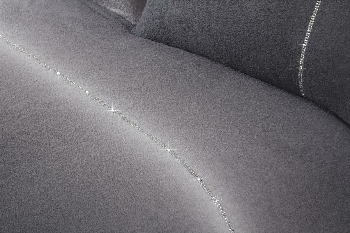 The duvet cover draped over a bed, illustrating its soft teddy fleece fabric and stylish design