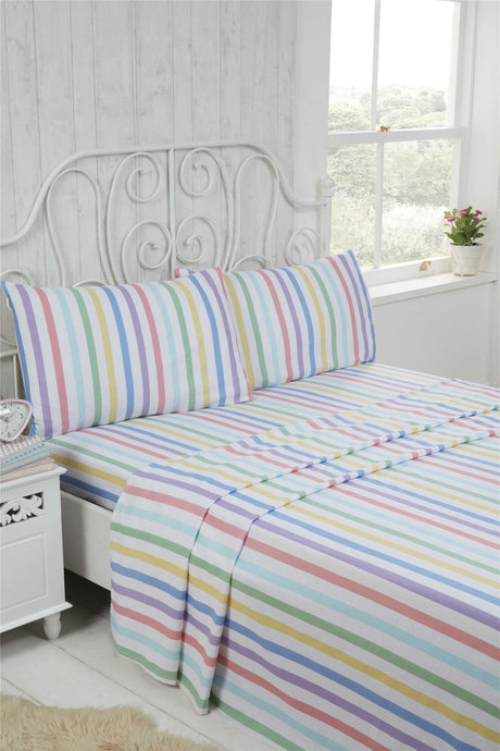 A cosy Candy Stripe Brushed Cotton Sheet Set featuring bright pastel shades, including a fitted sheet, flat sheet, and matching pillowcases, made from super soft 100% brushed cotton for comfortable winter nights