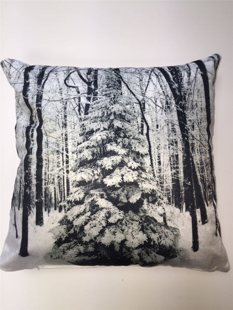 A 43x43cm Christmas-themed cushion featuring a snowy winter scene with a frosty tree printed on soft velvet fabric