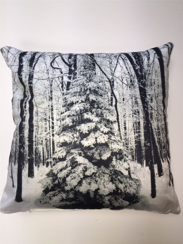 A 43x43cm Christmas-themed cushion featuring a snowy winter scene with a frosty tree printed on soft velvet fabric