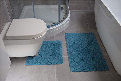 Kyra bath mat measuring 46x76cm featuring a comfortable, soft woven surface in a stylish pattern
