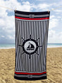 A nautical-themed beach towel measuring 85x160cm made from blended cotton, ideal for poolside or beach use and perfect as a gift