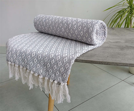 Eco-friendly Eden Cotton Throw showcasing modern geometric design on soft recycled cotton fabric