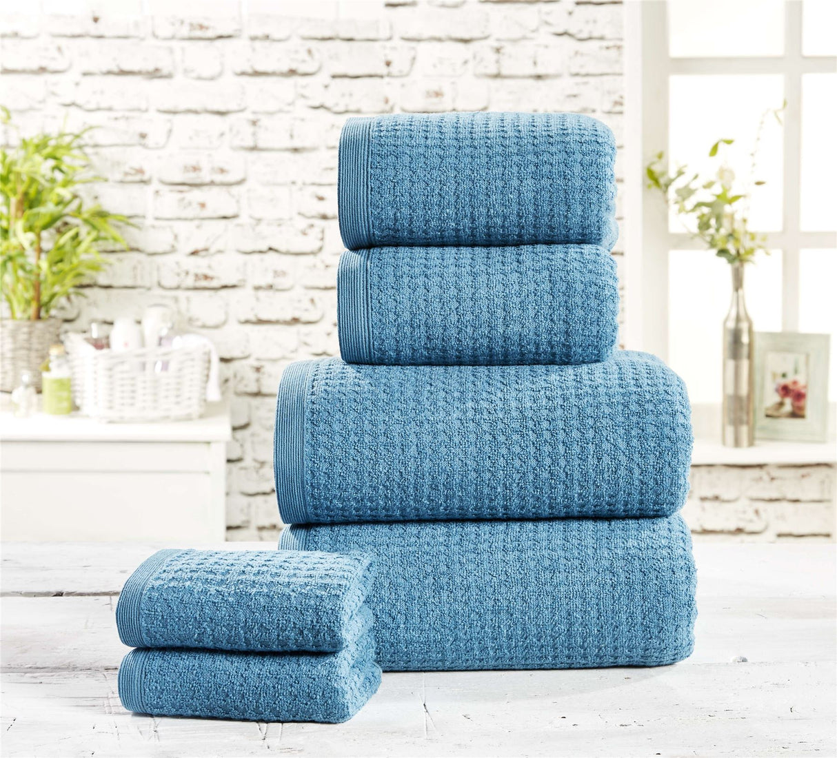 Soft and absorbent waffle towel in light grey color
