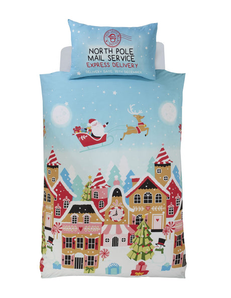 Festive Gingerbread Town Duvet Cover depicting snowy alpine scene with Santa's sleigh and decorated gingerbread houses