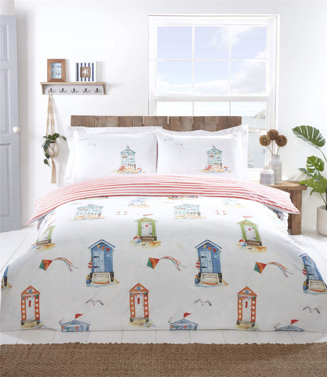 Brightly coloured Padstow Duvet Set featuring beach huts and seagulls in a watercolour style, fully reversible with a seaside stripe pattern on white microfibre fabric