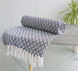 Elegant Eden Cotton Throw featuring a detailed geometric pattern and sustainable recycled cotton material
