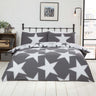 A large scattered star pattern on a reversible duvet cover with contrasting background