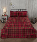Duvet covers with rustic stag motif and tartan print reverse, featuring button closures