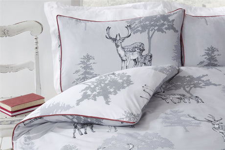 Reversible Sherwood Duvet Set featuring vibrant watercolour woodland scene and bold piping detail