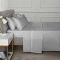 Detailed view of the fitted sheet's high-quality fabric, designed for a blissful sleep and easy care in the Happy Home Essentials line