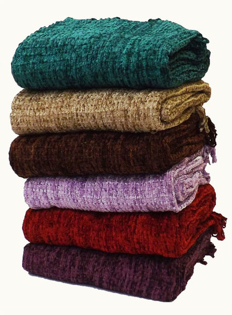 Zara Throw draped over a sofa, highlighting its vibrant colours and cosy appeal