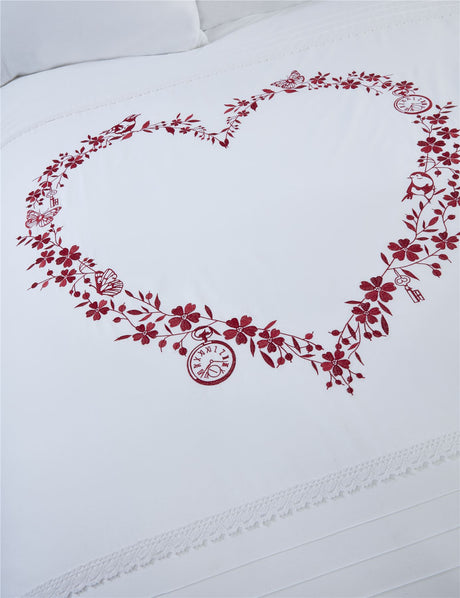 Full view of the single duvet cover with heart embroidery, pintucks, and button fastening for easy use