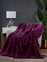 Detailed view of the rich coloured plush rabbit fur fabric, highlighting its softness and plushness