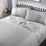A minimalistic Boston Duvet Set featuring a pinktuck band across the top cuff and pintuck detailing on pillowcase edges
