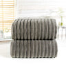 Luxuriously plush ribbed bathroom towel with stripe weave and silky sheen borders