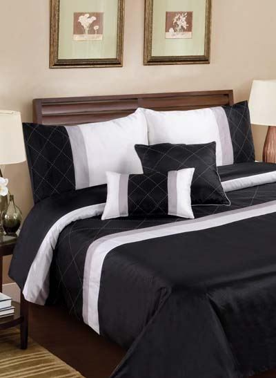 Elegant Monaco Filled Cushion featuring geometric embroidery and luxurious sequin trims