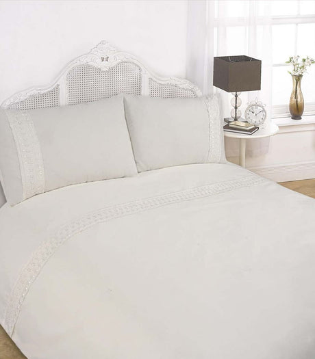 Luxurious Sorrento Duvet Set with elegant lace trim detail on the duvet header and matching pillowcases