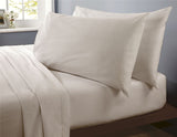 Close-up of a brushed cotton fitted sheet showcasing its soft, high-quality texture and comfortable feel