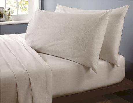 Close-up of a brushed cotton fitted sheet showcasing its soft, high-quality texture and comfortable feel