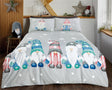A whimsical Gonk Family duvet set featuring adorable gonks with oversized hats, gloves, and boots on a grey background with twinkling stars and icicles, made from soft microfibre fabric with a fully reversible design, perfect for winter-themed bedrooms