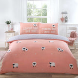 Cozy duvet set featuring a playful Counting Sheep design in blush pink with fluffy sheep and slogan