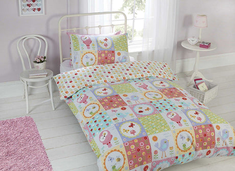 A detailed image of the Birdie Patchwork Duvet Set showcasing a charming patchwork design with various illustrations and patterns in soft, muted colours