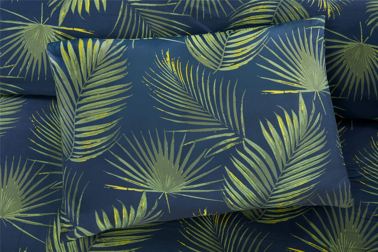 Modern Palma Duvet Set with vibrant tropical palm leaf pattern on navy fabric, includes matching pillowcases, easycare and machine washable for effortless maintenance