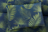 Modern Palma Duvet Set with vibrant tropical palm leaf pattern on navy fabric, includes matching pillowcases, easycare and machine washable for effortless maintenance