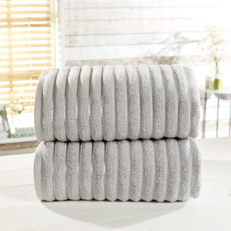 Soft and absorbent 100% pure cotton ribbed bath towel featuring subtle elegant stripe detailing