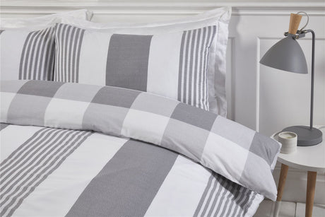 Packaging of the Happy Home duvet set in eco-friendly plastic-free packaging with popper closure for easy access