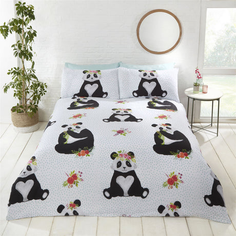 A soft polycotton duvet set featuring an adorable panda design with a love heart on its chest, set against a light blue spot background, including matching pillowcases in various sizes for single, double, and king beds